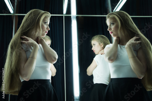 sexy girl and her reflection in mirror table