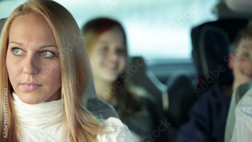 Wallpaper Mural a young, beautiful family with two children who are having fun back in the car, while driving in a car to a certain destination   Torontodigital.ca