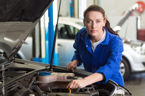 Mechanic working under the hood