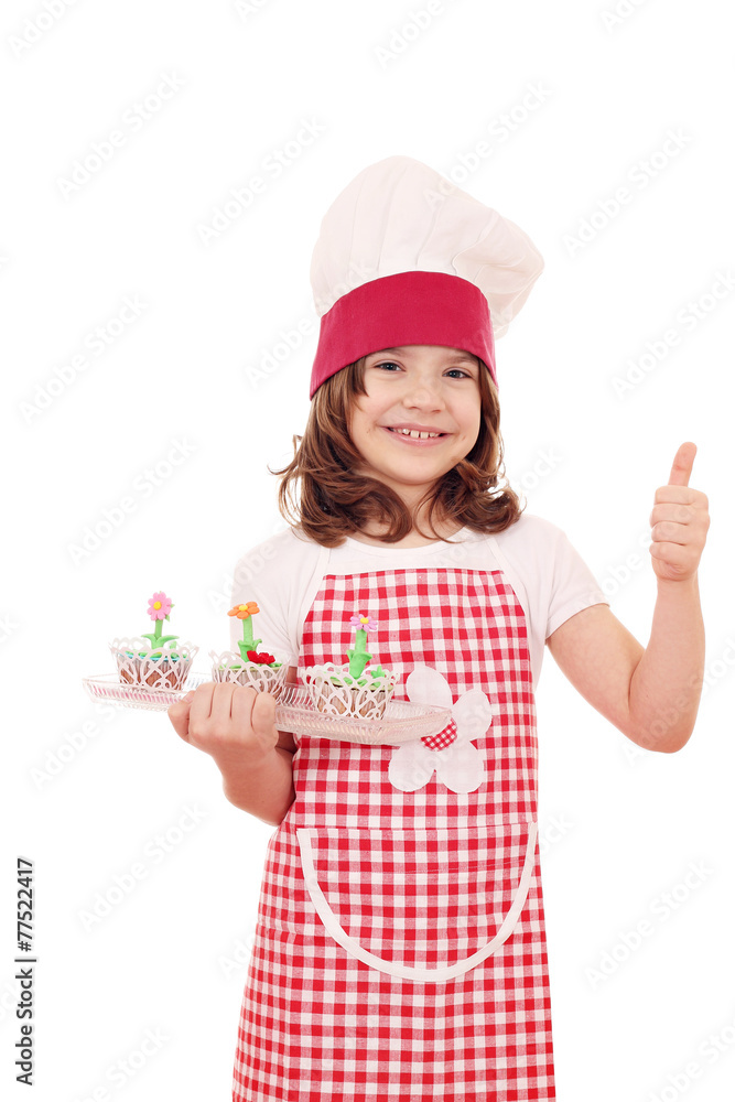 happy little girl cook with cupcakes and thumb up happy little girl cook with cupcakes and thumb up