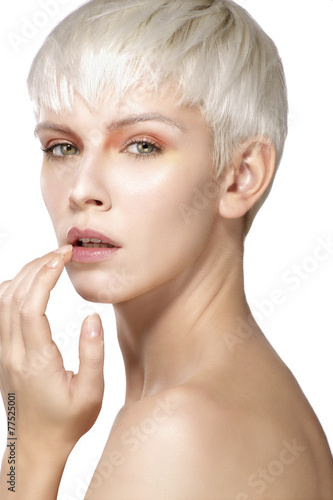 Beauty model blonde short hair showing perfect skin
