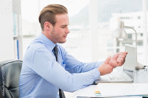 Fotografie Businessman suffering from wrist pain