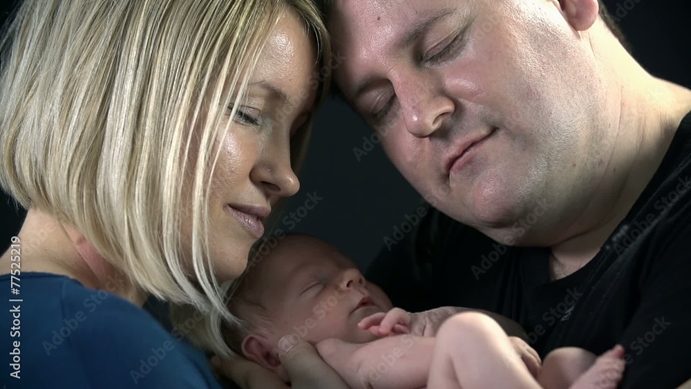 Close shot of parents and their newborn Close shot of parents and their newborn