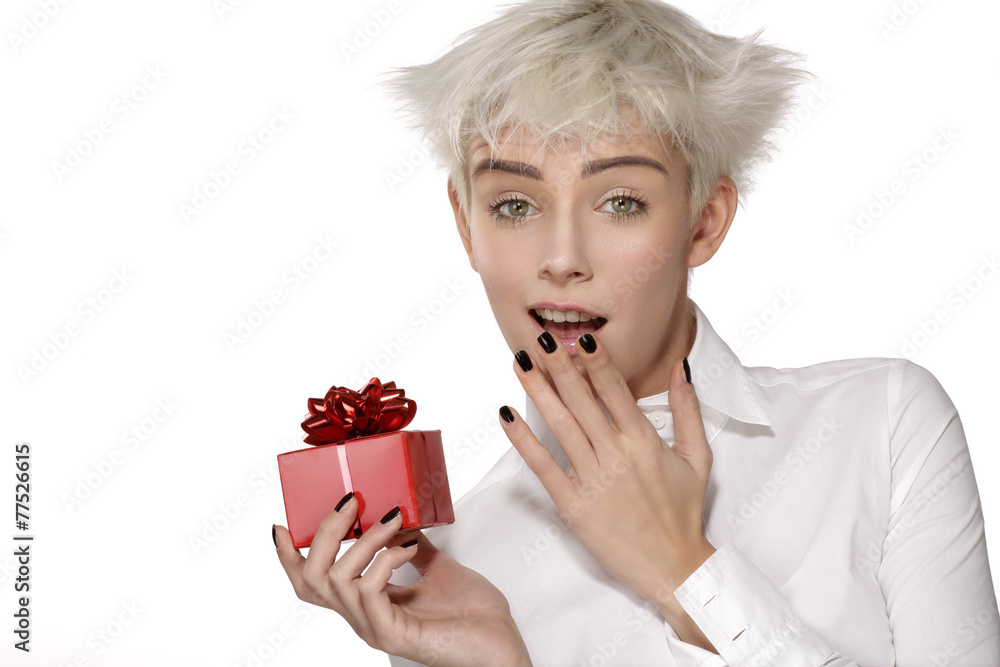 cute happy girl holding a gift in the hand cute happy girl holding a gift in the hand