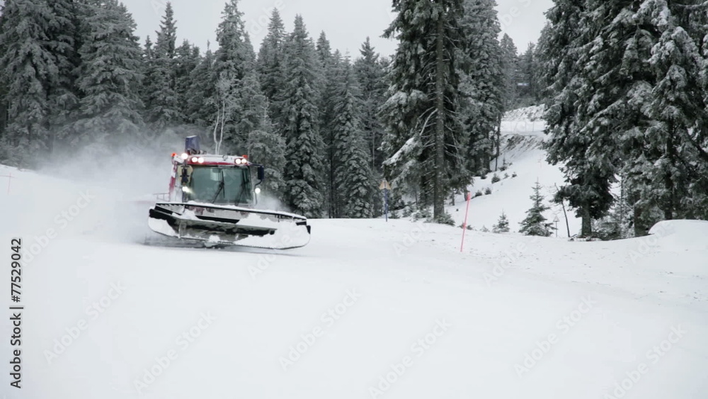 a idyllic ski slope and special machine in the winter time full of snow a idyllic ski slope and special machine in the winter time full of snow