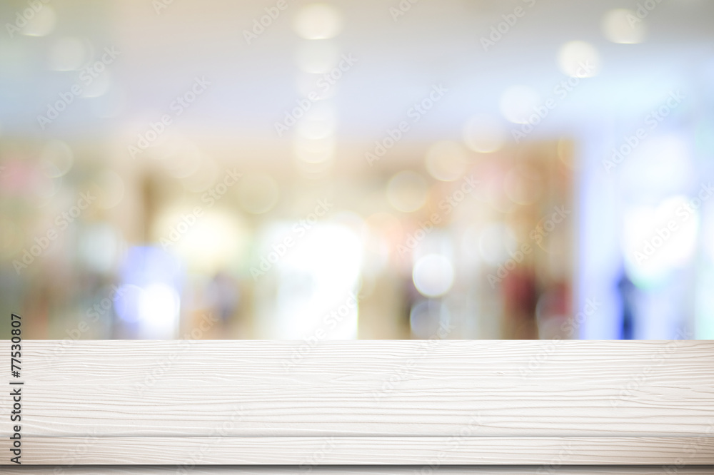 Empty white table and blurred store bokeh background Empty white table and blurred store bokeh background