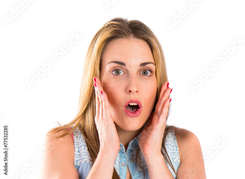 Girl doing surprise gesture over white background