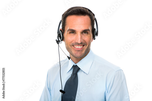 smiling man with headset working as a call center operator