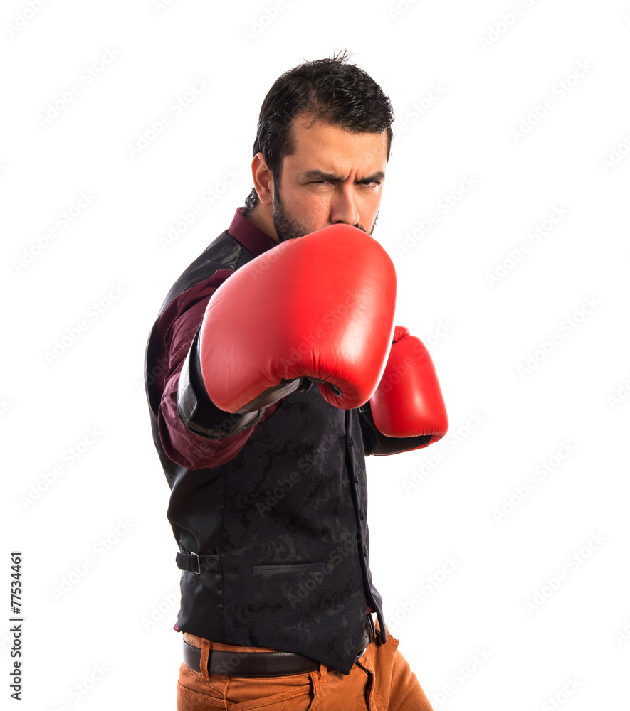 Man wearing waistcoat with boxing gloves Man wearing waistcoat with boxing gloves