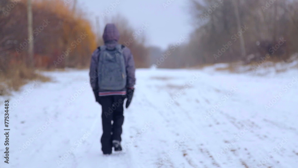 The child is a teenager, goes on winter road. The child is a teenager, goes on winter road.