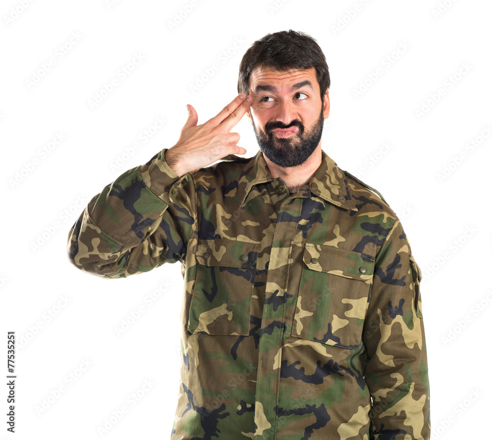 Soldier making suicide gesture Soldier making suicide gesture