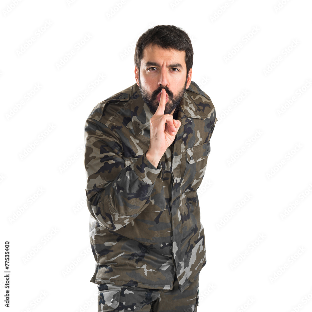 Soldier making silence gesture
