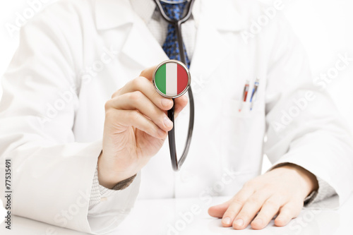 Doctor holding stethoscope with flag series - Italy photo