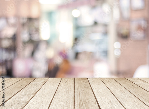 Perspective wood and blurred cafe with bokeh light background