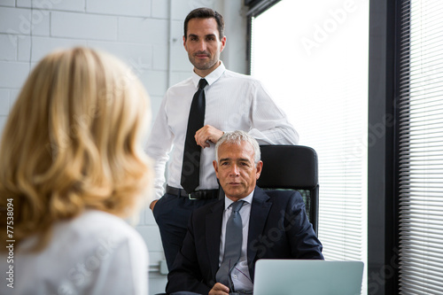 Three businesspeople having a meeting