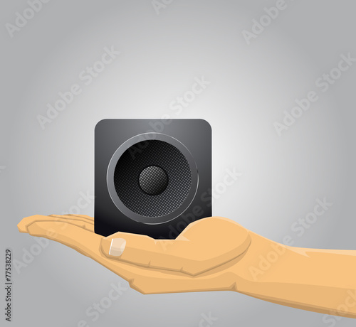 Hand holding a speaker