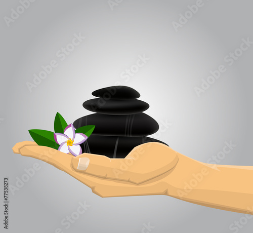 Hand holding Spa stones andflower