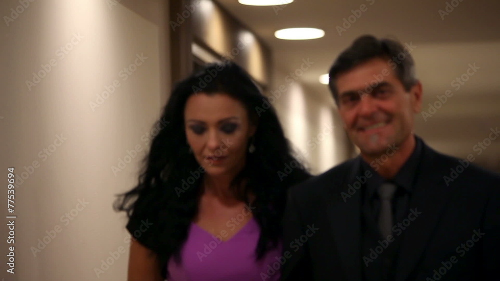 Shot of a symphatic couple walking in fancy hotel lounge Shot of a symphatic couple walking in fancy hotel lounge
