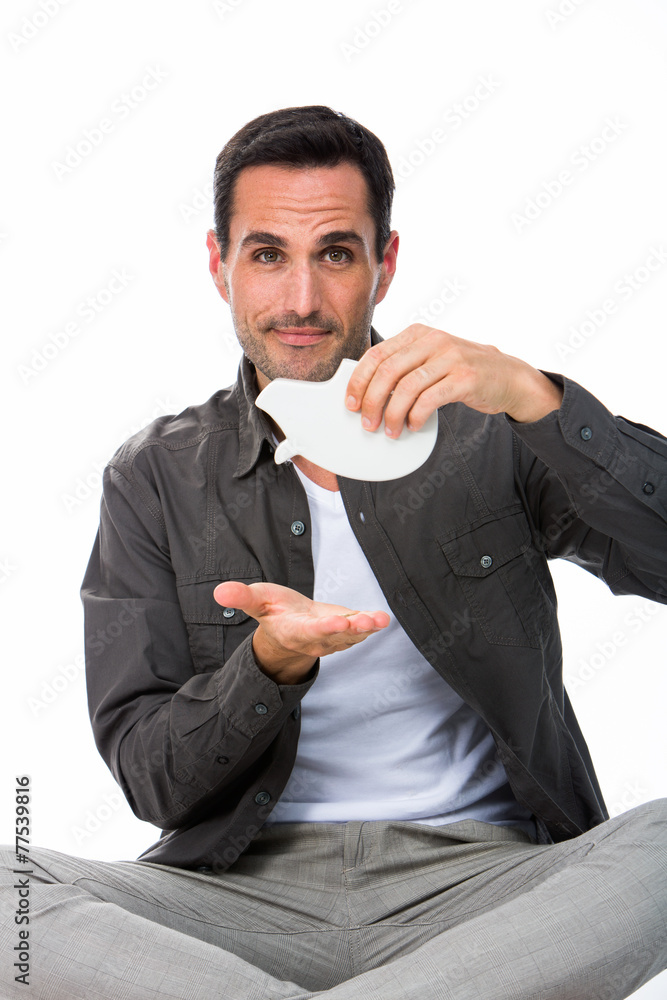 Man sitted on the floor with piggy bank Stock Photo | Adobe Stock