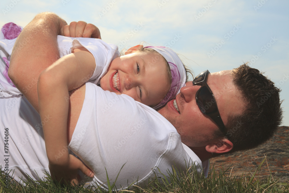 A father and daughter having fun outside A father and daughter having fun outside