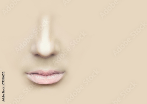 Female nose and lips on the physical background.