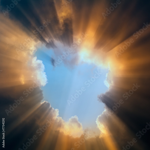 Sunshine rays among dramatic clouds.