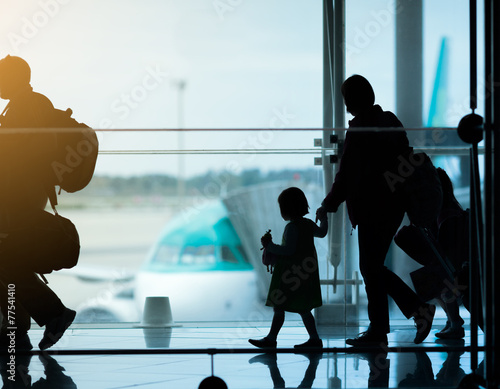 Silhouette of family at airport