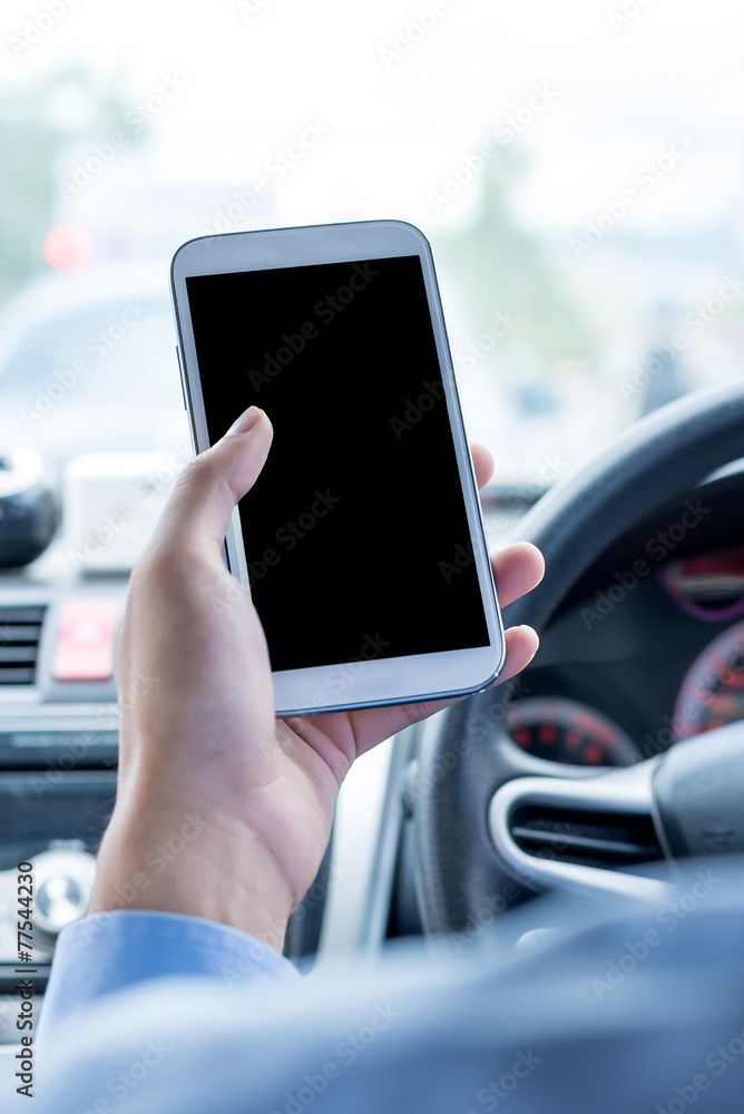 Men use the smartphone at driving time Men use the smartphone at driving time