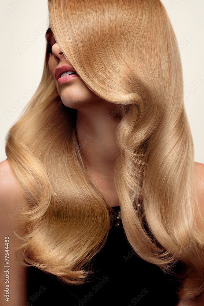 Fotografia Blond hair. Portrait of beautiful Blonde with Long Wavy Hair. Hi  su EuroPosters.it
