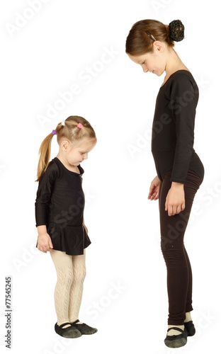 Obraz na płótnie Two Little Girl dancer on White Background w salonie