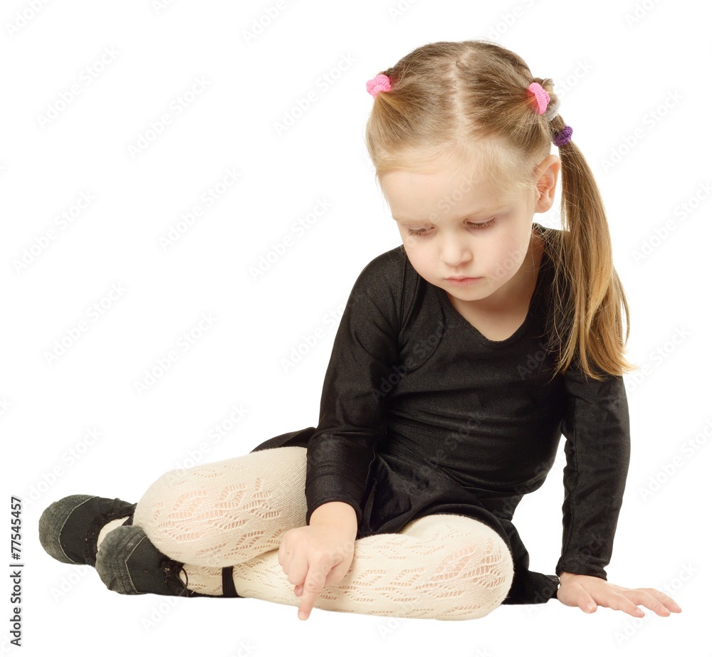 Little Girl dancer sits on White Background
