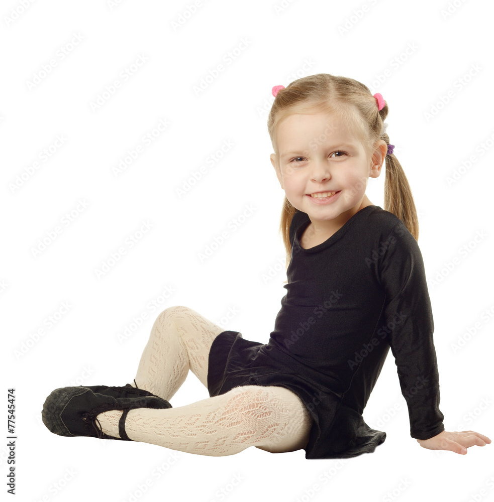 Little Girl dancer sits on White Background