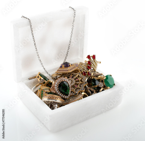 Marble box with jewelry on white background photo