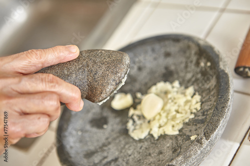 Crushing garlic photo