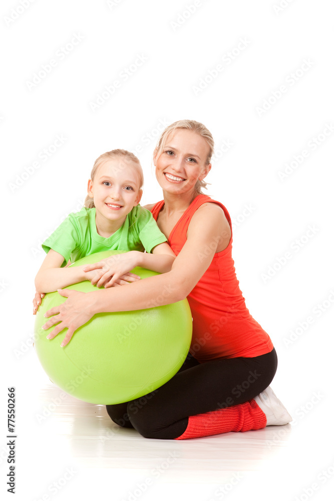Little girl doing exercise with an instructor Little girl doing exercise with an instructor