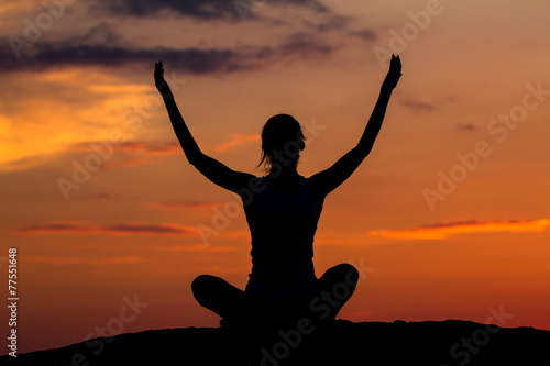 Silhouette of a beautiful Yoga woman in the morning