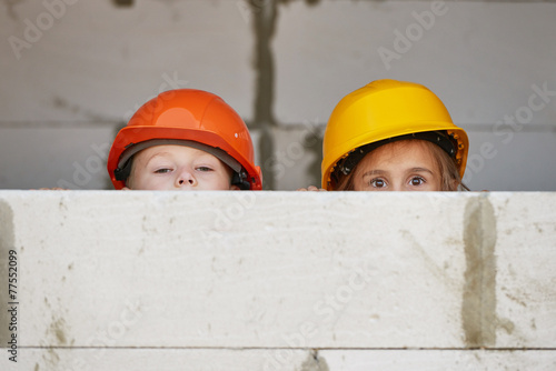 boy and girl playing on construction site
