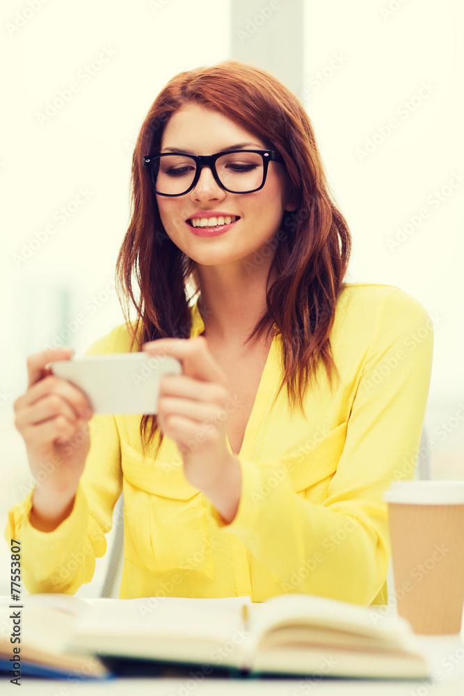 smiling student girl with smartphone at school smiling student girl with smartphone at school