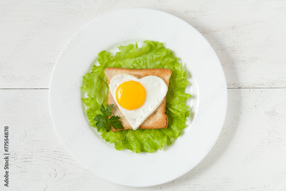 Concept of healthy breakfast - slice of wholewheat toast and egg Concept of healthy breakfast - slice of wholewheat toast and egg