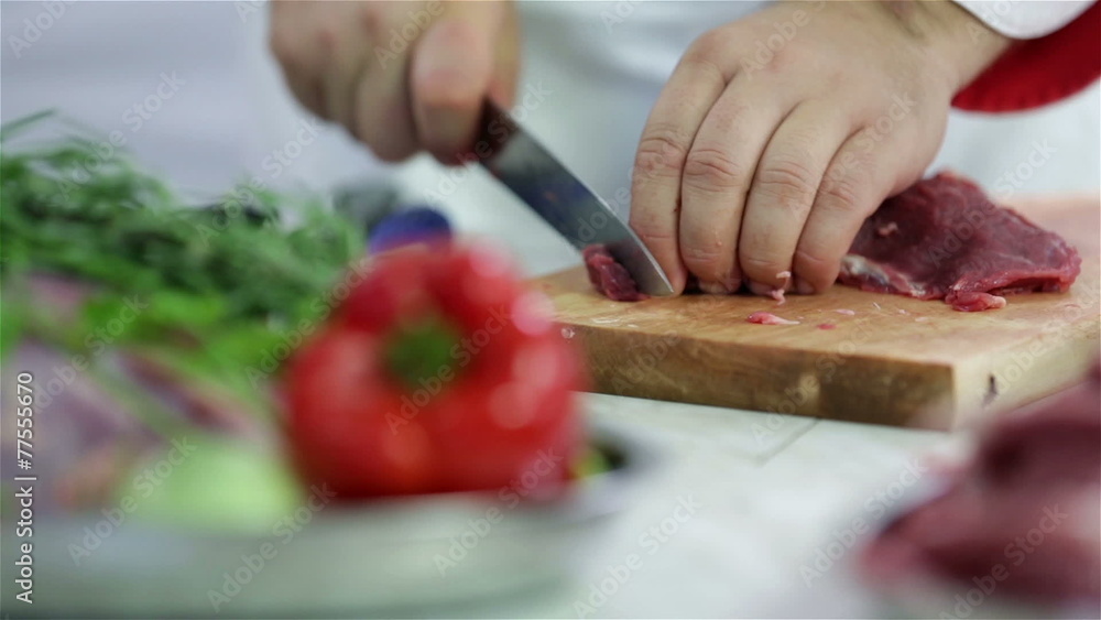 Making small pieces of red meat for soup with vegetables