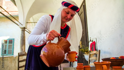 Turkish made poring the drink in to clay jars
 photo