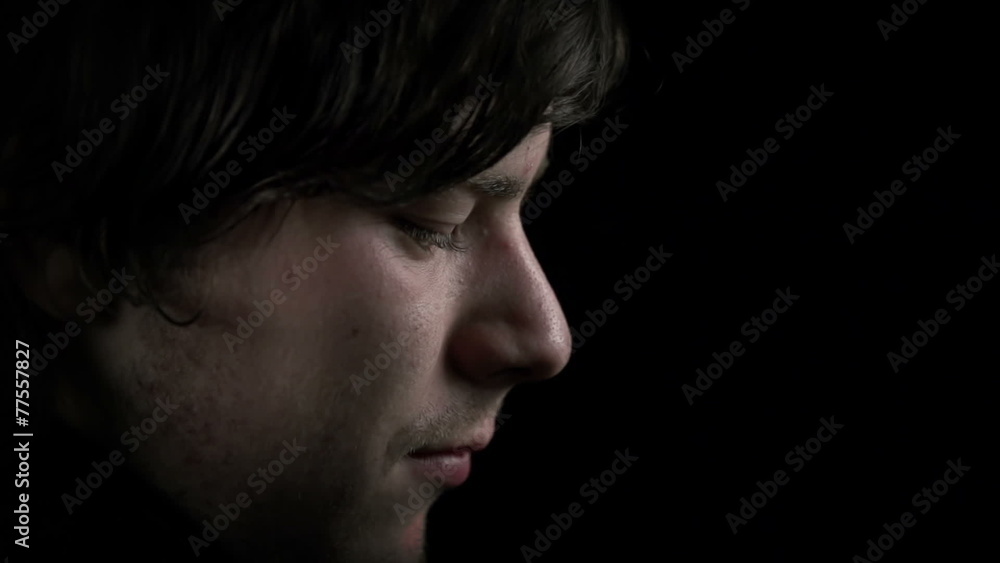 Detail shot of young man's face taking a cigarette Detail shot of young man's face taking a cigarette