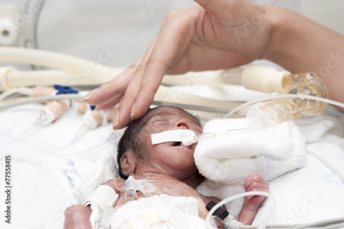 Newborn and hand