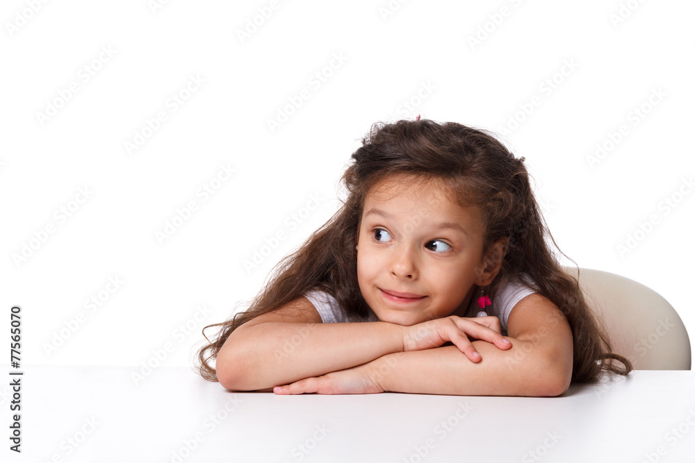 little girl sitting at the table. emotions concept little girl sitting at the table. emotions concept