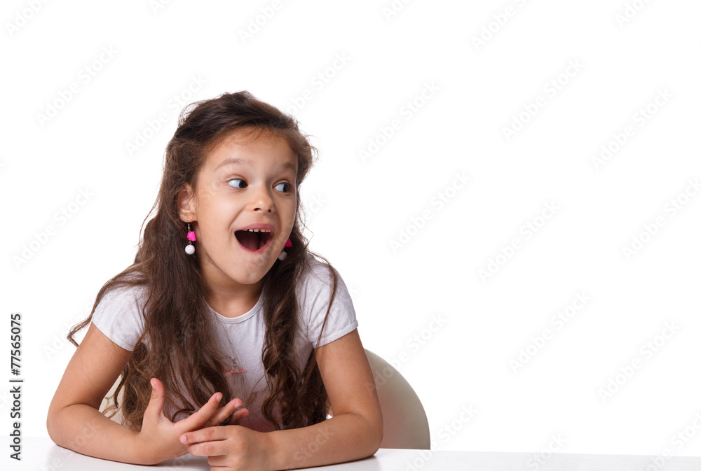 little girl sitting at the table. emotions concept little girl sitting at the table. emotions concept
