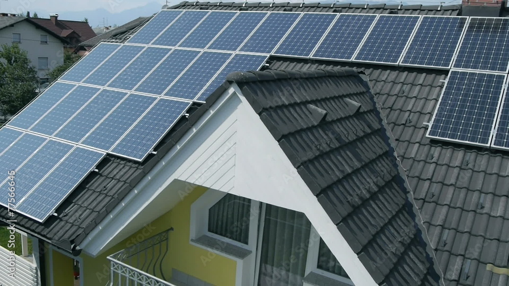 Panorama slide shot from helicopter representing an industrial part of a small town with roofs covered with solar power stations