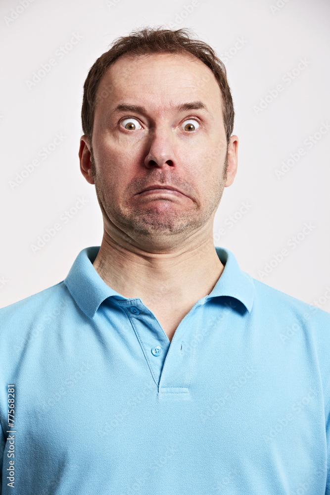 Fototapeta premium Mann macht Grimassen