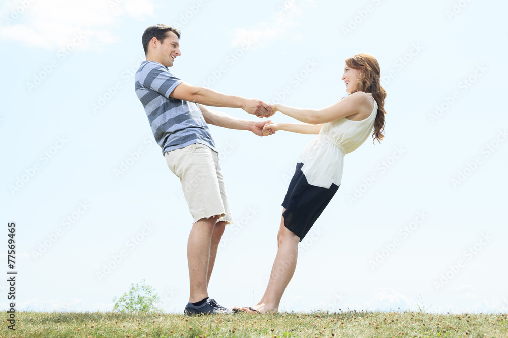 A couple outside having fun together outside A couple outside having fun together outside