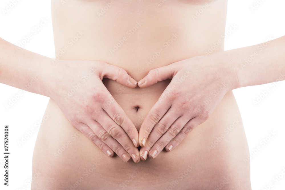 Young Woman with Heart Shaped Hands in front of Belly. Young Woman with Heart Shaped Hands in front of Belly.