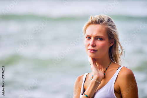 Beautiful young blonde woman posing outdoor at the rocky sea sho © -Marcus-